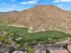 Scenic aerial view of a lush golf course with desert landscape at 7354 E Norwood St, Mesa, AZ 85207