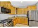 Open kitchen with granite countertops, stainless steel appliances, and light colored cabinets at 7354 E Norwood St, Mesa, AZ 85207