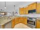 Kitchen area with granite countertops and stainless steel appliances and eat in bar at 7354 E Norwood St, Mesa, AZ 85207
