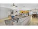 Open-concept living room, kitchen and dining area with travertine floors at 7354 E Norwood St, Mesa, AZ 85207