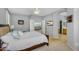 This main bedroom includes a ceiling fan, and an entrance to a lounge, bathroom, and walk-in closet at 7354 E Norwood St, Mesa, AZ 85207