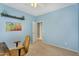 This office includes wall art, plants, and a dark wooden desk with a brown chair at 7354 E Norwood St, Mesa, AZ 85207