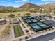 Aerial view of pickleball and bocce ball courts in a community with mountain views at 7354 E Norwood St, Mesa, AZ 85207