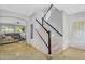Bright entryway with a staircase featuring modern railings and natural light at 7354 E Norwood St, Mesa, AZ 85207