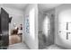 Bathroom featuring a glass shower and view into the primary bedroom at 7820 N 5Th Ave, Phoenix, AZ 85021