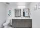 Modern bathroom with double sink vanity and toilet at 7820 N 5Th Ave, Phoenix, AZ 85021