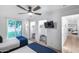 Comfortable bedroom with large windows, a ceiling fan, and closet space at 7820 N 5Th Ave, Phoenix, AZ 85021