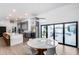 Dining area features a view of the pool, modern lighting, and is open to the kitchen at 7820 N 5Th Ave, Phoenix, AZ 85021