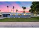 Modern home exterior showcasing sleek design, desert landscaping, and a stylish garage door at 7820 N 5Th Ave, Phoenix, AZ 85021