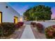 Charming walkway lined with lush landscaping leading to a modern home at 7820 N 5Th Ave, Phoenix, AZ 85021