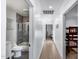 Hallway view of a bathroom with a shower/tub combo and a bedroom with bunk beds at 7820 N 5Th Ave, Phoenix, AZ 85021
