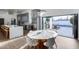 Bright kitchen features a large island, gray cabinets, and seamless indoor-outdoor living with views of the pool at 7820 N 5Th Ave, Phoenix, AZ 85021