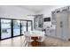 Eat-in kitchen featuring a dining table, stylish cabinets, and seamless indoor-outdoor flow at 7820 N 5Th Ave, Phoenix, AZ 85021