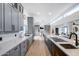 Spacious, modern kitchen with gray cabinets, quartz counters, and stainless steel appliances at 7820 N 5Th Ave, Phoenix, AZ 85021
