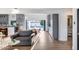 Bright living room with open floor plan, leading to a kitchen and dining area at 7820 N 5Th Ave, Phoenix, AZ 85021