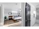 Bright main bedroom boasts wood flooring, chic decor, and an ensuite bathroom at 7820 N 5Th Ave, Phoenix, AZ 85021
