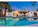 Backyard pool area with lounge chairs and an outdoor dining space at 7820 N 5Th Ave, Phoenix, AZ 85021