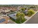 Aerial view showcasing the home's backyard, landscaping, and surrounding neighborhood at 8229 E Devonshire Ave, Scottsdale, AZ 85251