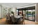 Dining area with views of the pool and a built-in wine rack at 8229 E Devonshire Ave, Scottsdale, AZ 85251