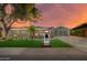 Charming home with well-manicured lawn, landscape lighting, and stylish curb appeal at 8229 E Devonshire Ave, Scottsdale, AZ 85251