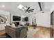 Bright and airy living room with hardwood floors, stylish seating, and a cozy atmosphere at 8229 E Devonshire Ave, Scottsdale, AZ 85251