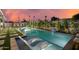 Inviting backyard pool featuring stylish lounge chairs and lush landscaping, perfect for relaxing evenings at 8229 E Devonshire Ave, Scottsdale, AZ 85251