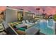 Luxurious pool featuring in-pool loungers, lush landscaping, and a covered patio with modern architectural design at 8229 E Devonshire Ave, Scottsdale, AZ 85251