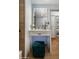 Beautiful vanity with soft lighting, stylish stool, and seamless access to the main bedroom at 8229 E Devonshire Ave, Scottsdale, AZ 85251