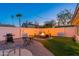 Inviting backyard featuring a cozy fire pit area, perfect for entertaining or relaxing under the stars at 8431 E Rose Ln, Scottsdale, AZ 85250