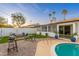 Outdoor space with BBQ grill, firepit, and access to the swimming pool at 8431 E Rose Ln, Scottsdale, AZ 85250