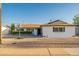 Charming single-story home featuring a tidy yard, basketball hoop, and neutral-toned exterior at 8431 E Rose Ln, Scottsdale, AZ 85250