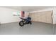Spacious two car garage with epoxy flooring and plenty of space at 8431 E Rose Ln, Scottsdale, AZ 85250