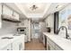 Efficient kitchen with modern appliances, sleek countertops, and tile flooring at 8431 E Rose Ln, Scottsdale, AZ 85250