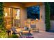 Cozy back patio with built-in grill, outdoor seating, and serene garden views at 10040 E Happy Valley Rd # 2022, Scottsdale, AZ 85255