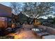 Desert backyard with mature trees, cacti, and an outdoor seating area at 10040 E Happy Valley Rd # 2022, Scottsdale, AZ 85255