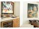 Bar area with wine fridge, marble countertops, and stylish decor in the entertainment space at 10040 E Happy Valley Rd # 2022, Scottsdale, AZ 85255