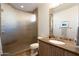 Modern bathroom with glass shower, vanity, and stone countertops at 10040 E Happy Valley Rd # 2022, Scottsdale, AZ 85255