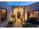 Inviting front entrance with desert landscaping and a modern front door at 10040 E Happy Valley Rd # 2022, Scottsdale, AZ 85255