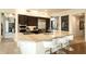 Spacious kitchen boasts granite island with bar seating, stainless steel appliances, and ample cabinet space at 10040 E Happy Valley Rd # 2022, Scottsdale, AZ 85255