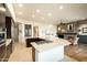 Spacious kitchen with stainless steel appliances, a large island, and a view to the living space at 10040 E Happy Valley Rd # 2022, Scottsdale, AZ 85255