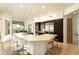 Bright kitchen features a large granite island with seating, modern stainless appliances, and stylish finishes at 10040 E Happy Valley Rd # 2022, Scottsdale, AZ 85255