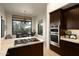 Well-appointed kitchen features a granite island, stainless steel appliances, and view to the breakfast nook at 10040 E Happy Valley Rd # 2022, Scottsdale, AZ 85255