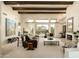 Bright and spacious living room with high ceilings, comfortable seating, and seamless access to the outdoor pool area at 10040 E Happy Valley Rd # 2022, Scottsdale, AZ 85255