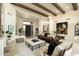 Spacious living room with high ceilings, exposed wood beams, comfortable seating and stylish decor at 10040 E Happy Valley Rd # 2022, Scottsdale, AZ 85255