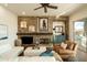 Inviting living room with stone fireplace, beamed mantle, and ample seating creates a warm, stylish gathering space at 10040 E Happy Valley Rd # 2022, Scottsdale, AZ 85255