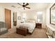 Serene main bedroom with neutral tones, natural light, and comfortable furnishings at 10040 E Happy Valley Rd # 2022, Scottsdale, AZ 85255