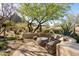 Cozy patio seating area features comfortable wicker furniture and a view of the natural desert landscape at 10040 E Happy Valley Rd # 2022, Scottsdale, AZ 85255