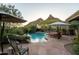 Inviting backyard pool and patio area with desert mountain views, lounge chairs and manicured landscaping at 10040 E Happy Valley Rd # 2022, Scottsdale, AZ 85255