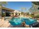 Beautiful pool and patio area with comfortable seating and umbrellas at 10040 E Happy Valley Rd # 2022, Scottsdale, AZ 85255