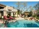 Stunning pool with rock waterfall and lush landscaping at 10040 E Happy Valley Rd # 2022, Scottsdale, AZ 85255